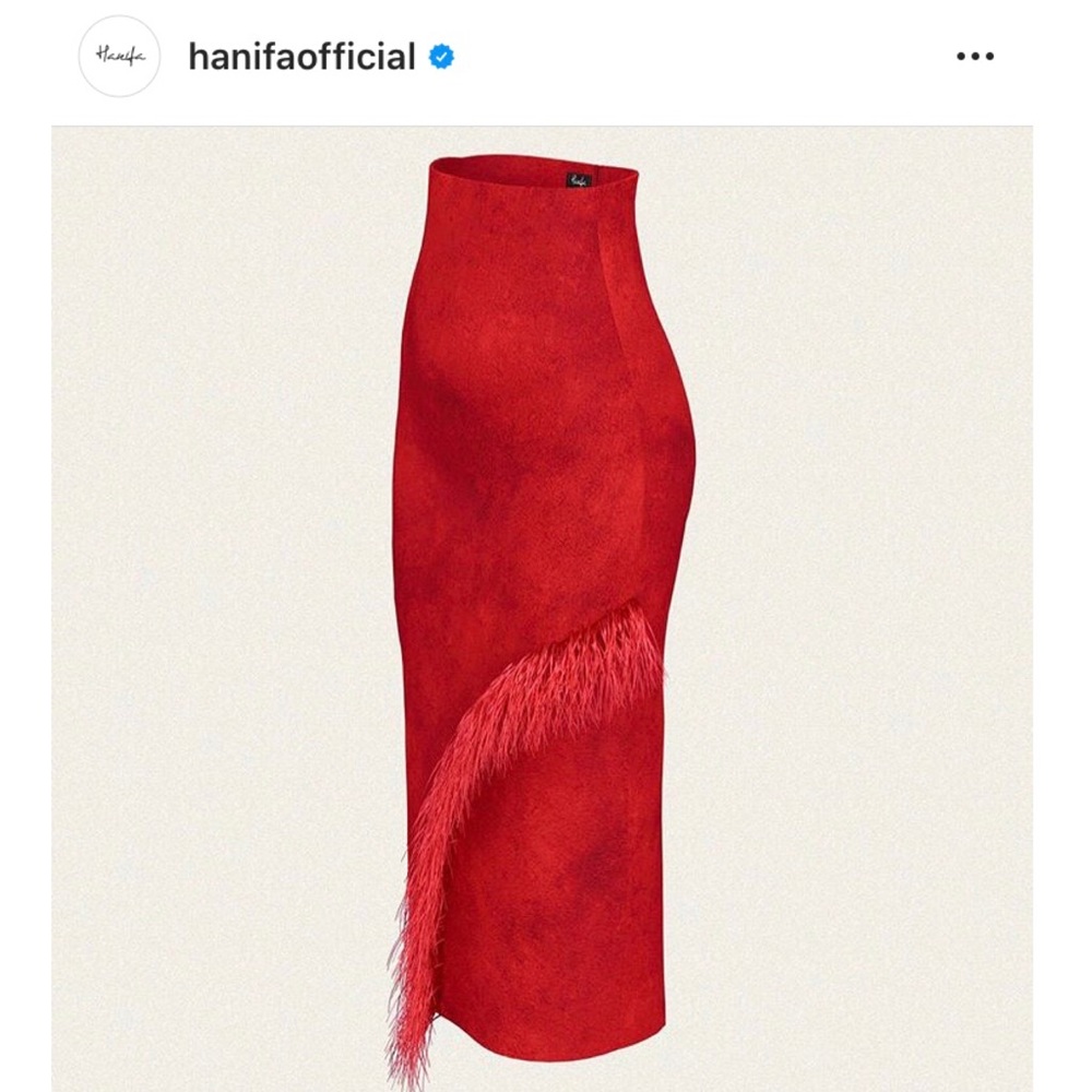 Red suede high waisted skirt with feather detail